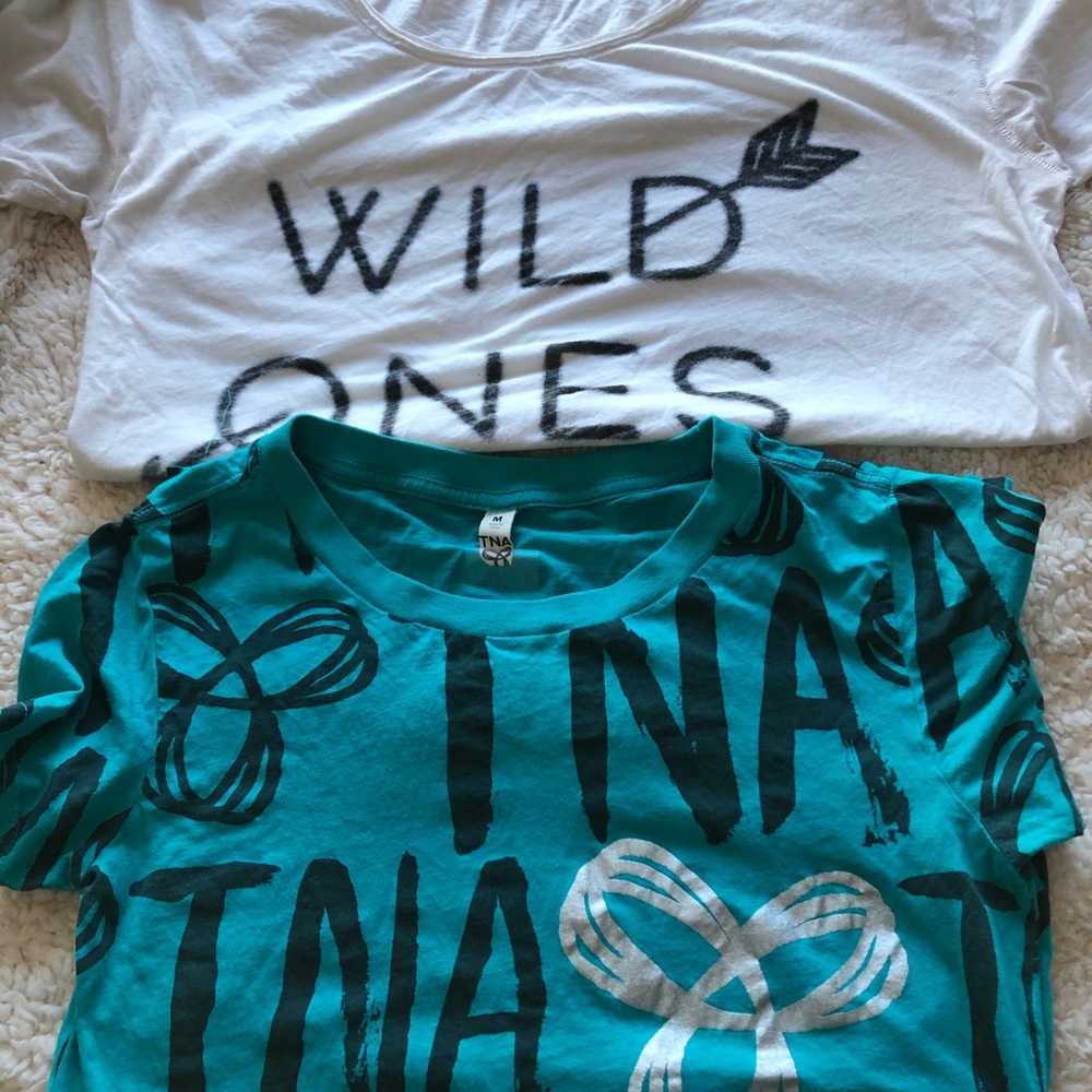 2 TNA tshirts